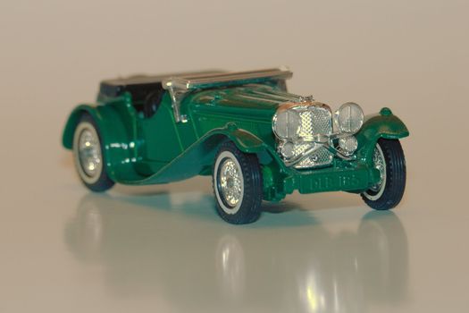 A green miniature toy car