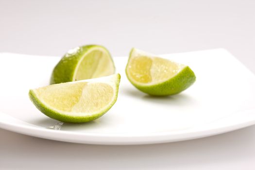 food series: tasty green sliced lime on plate