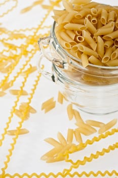 food series: uncooked pasta in glassy bowl