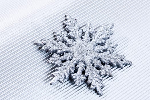 Holiday series: christmas silver snowflake over gray