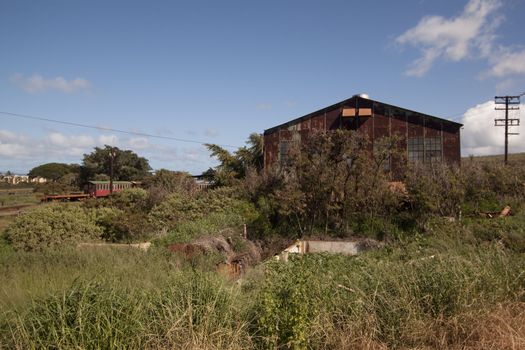 Old abandoned rusty tropical barn.