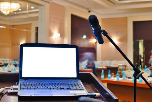 empty rostrum and notebook with blank screen 