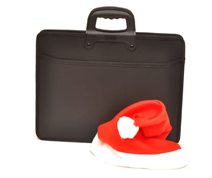 Black business briefcase with Santa's hat isolated on a white background