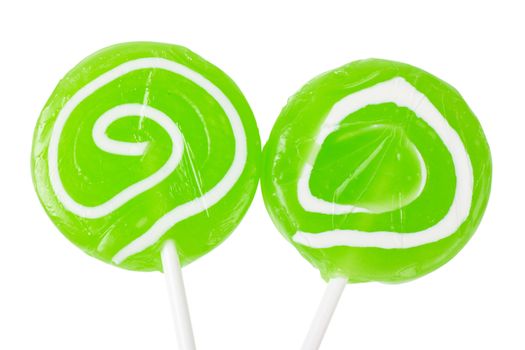 Macro view of two green lollipops isolated over white background
