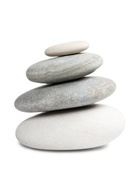 Stack of four round stones isolated over white background