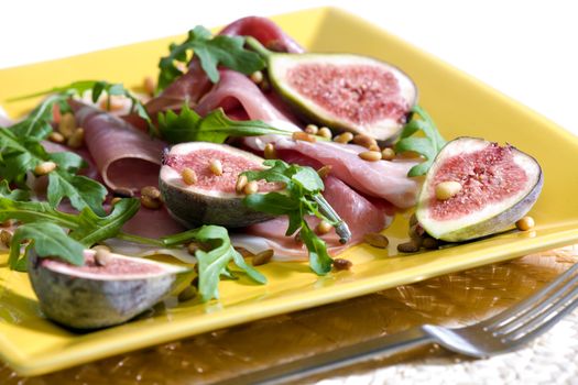 Spanish ham with figs and pine nuts