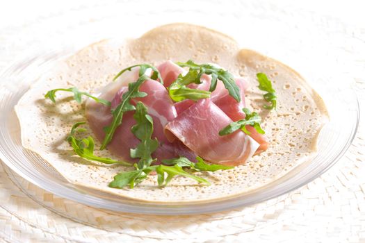French pancake with Italian ham and ruccola