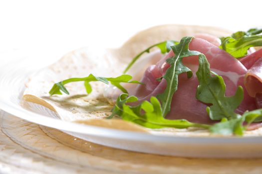 French pancake with Italian ham and ruccola