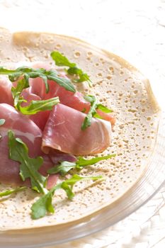 French pancake with Italian ham and ruccola