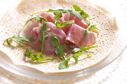 French pancake with Italian ham and ruccola