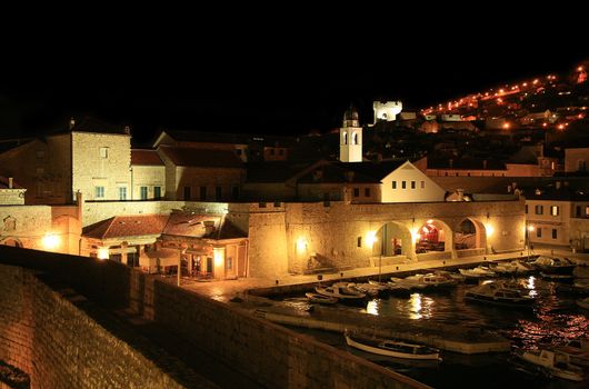 Stari Grad ( Old Town ) and famoust historic harbor in Dubrovnik – Croatia by night.