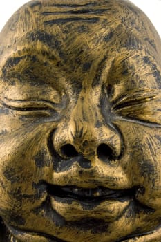 close up of golden buddha face