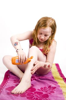 young girl is protecting herself against the sun