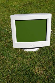 computer monitor on the grass depicting outsourcing