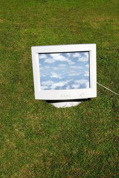 computer monitor on the grass depicting outsourcing