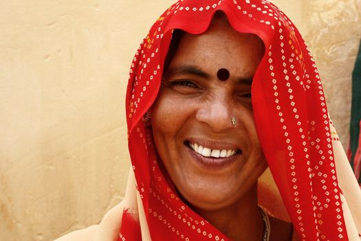 female wearing red sari - India