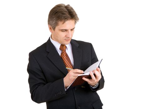 businessman writing something in his notebook