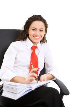 businesswoman seat in armchair and holds pen and book