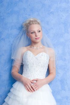 pensive bride on the blue background