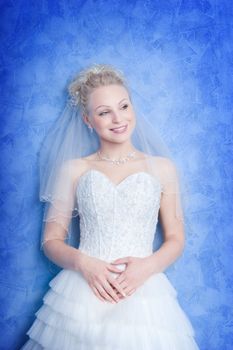 smiling bride on the blue background