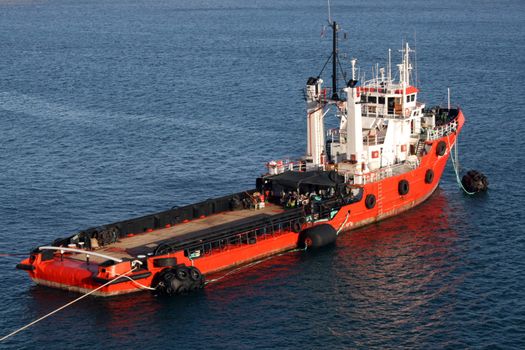 red tug boat berthed in Malta