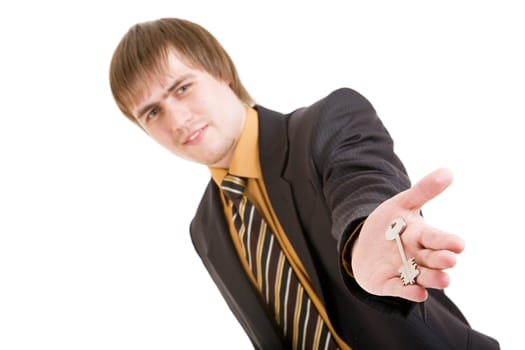 businessman with a key in opened hand