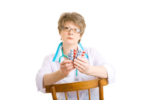 doctor with pills on the chair