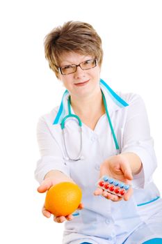 doctor with medcine in one hand and orange in another