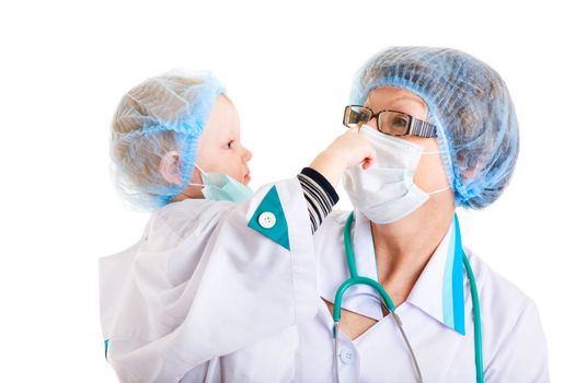 small girl dressed as a doctor in the hands of her grandmother - the medical worker