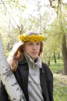 young man in wreath of dandelions