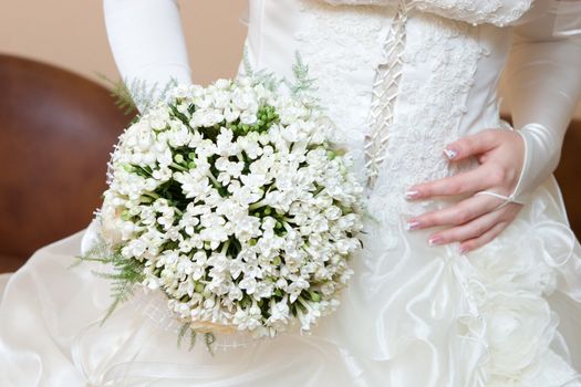 bride, dress and snowdrop flower bouquet