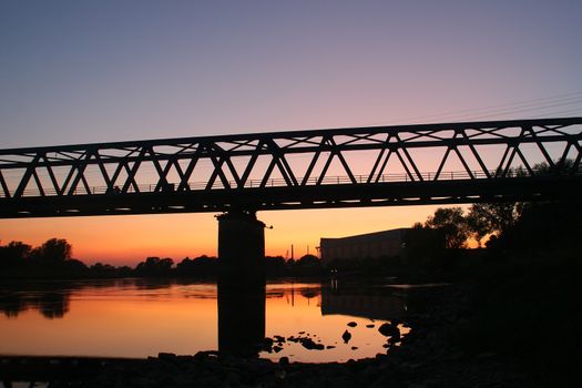 Railway bridge over the Elbe in Dessau-Ro�lau / Saxony-Anhalt / Germany, in the late evening twilight
