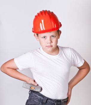 Portrait of a boy in a red protective helmet