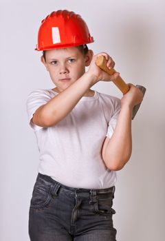 Portrait of a boy in a red protective helmet