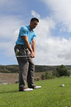 Young golfer preparing for a fairway shot