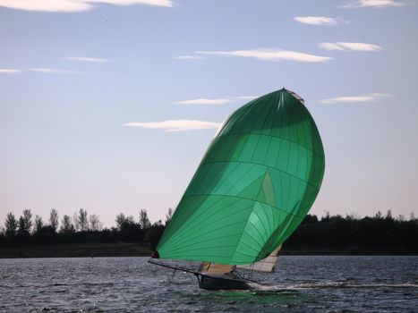 Green sailed sailboat