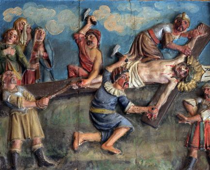 Crucifixion: Jesus is nailed to the cross