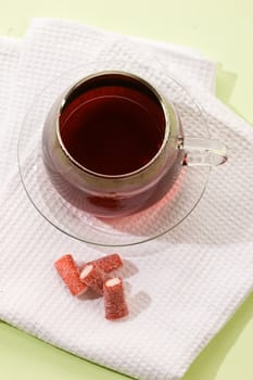 drink series: cup of hot tea with candy