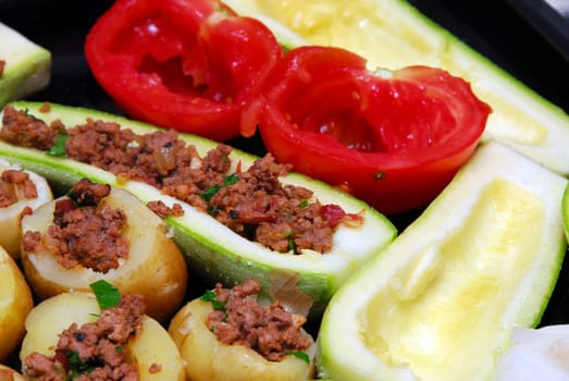 preparing fresh stuffed vegetables with minced meat