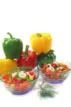 colorful bell pepper salad with dill in small glass bowl