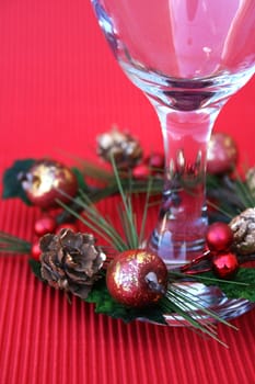 Wine Glass with a wreath part of a Christmas table setting
