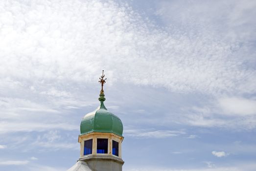 The Green Dome of a Pavilion with a weathervane on North Pier Blackpool under a blue sky