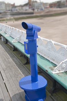A Blue Public Telescope on an english seaside pier
