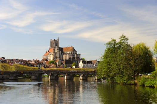 The Cathedral of Saint Etienne at Auxerre, from the Yonne River. Space for text in the sky.
