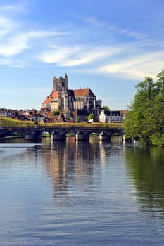 The Cathedral of Saint Etienne at Auxerre, from the Yonne River. Space for text in the sky.
