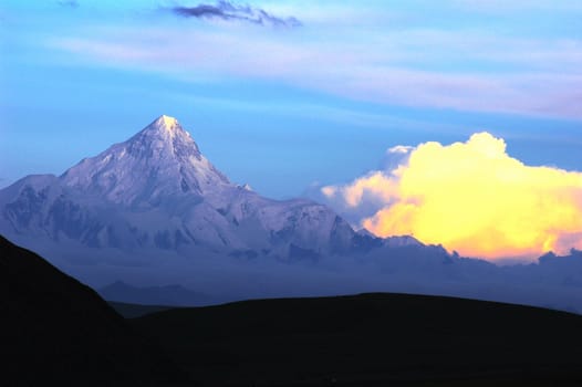 Landscape of snow-capped mountains of Gongga in Sichuan, China at sunset