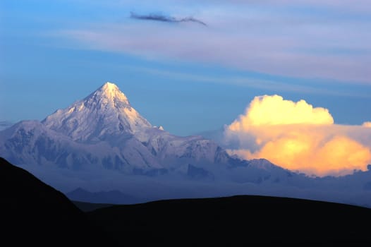 Landscape of snow-capped mountains of Gongga in Sichuan, China at sunset