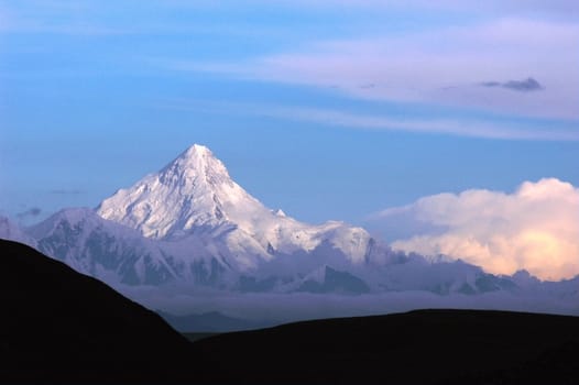 Landscape of snow-capped mountains of Gongga in Sichuan, China at sunset