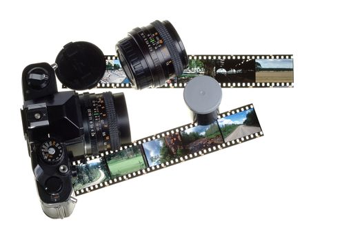 Old manual slr camera gear and transparency slide film.