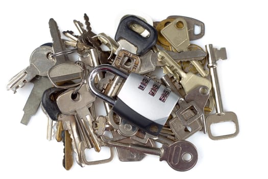 A combination padlock on top of a bunch of keys